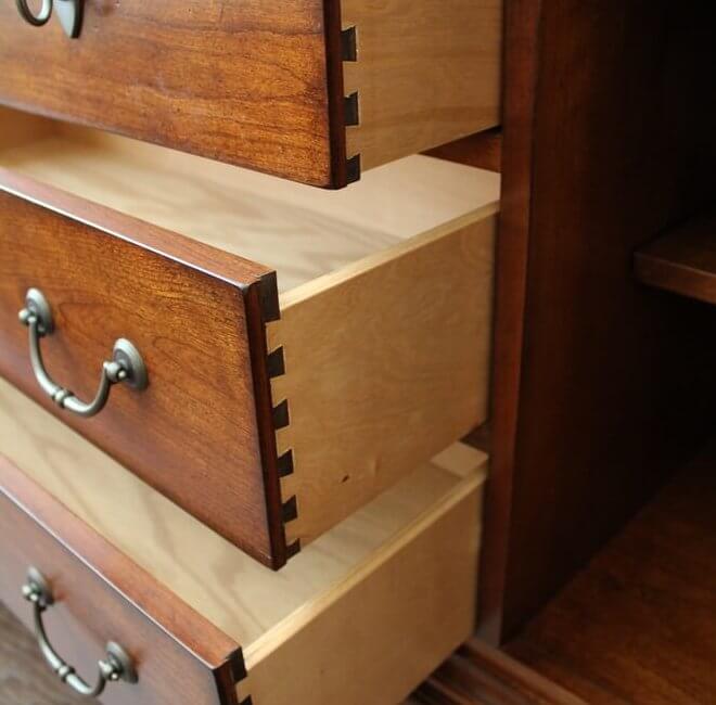 Dovetailed drawer boxes in cherry and maple.